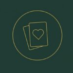 playing cards icon in golden colour with pine green backgound
